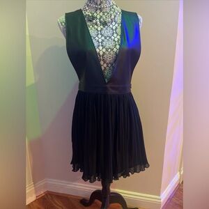 Brand New Mini dress/tunic. Faux leather on top, sheer bottom (lined).